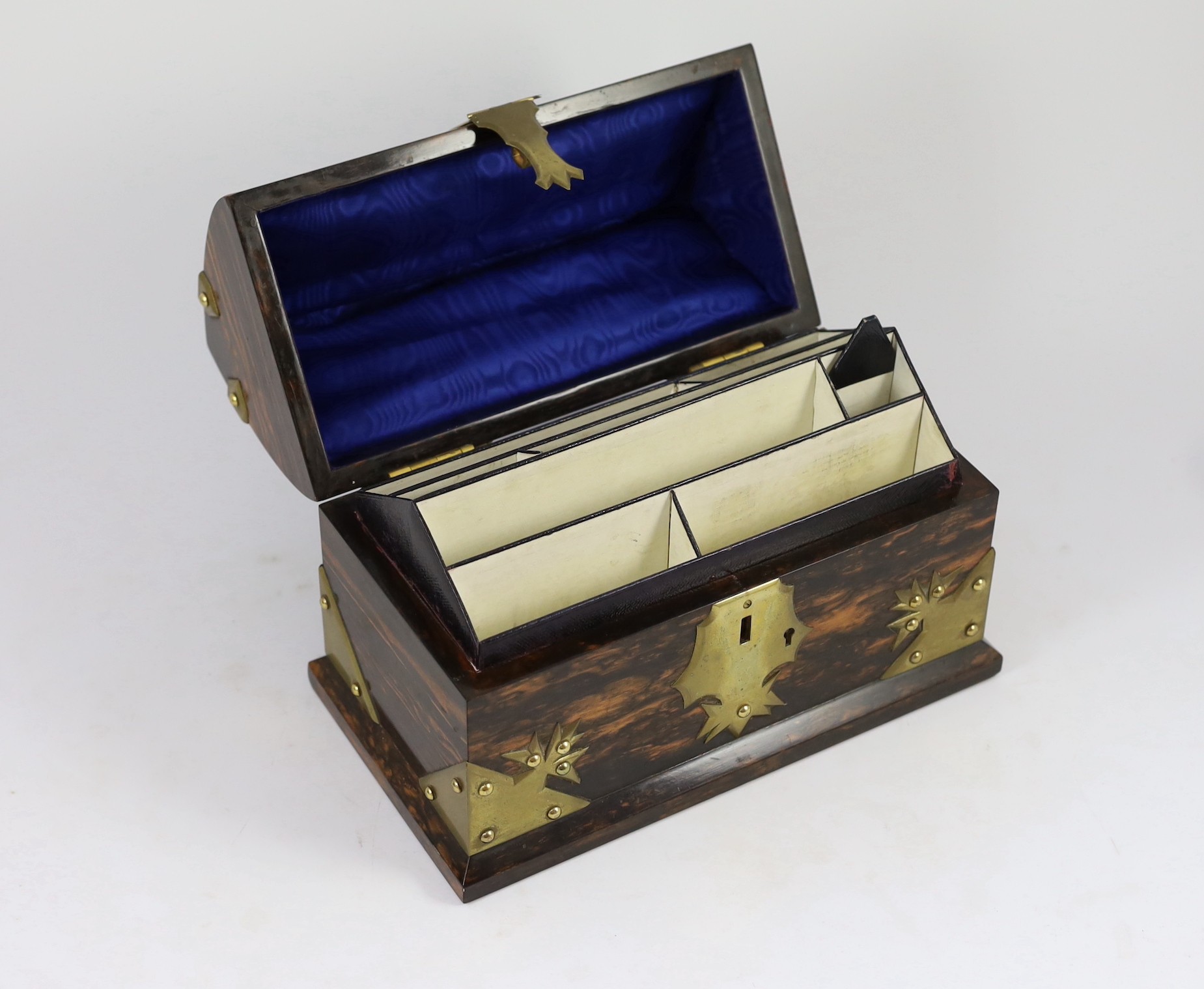A Victorian brass mounted coromandel wood stationery casket with matching blotter, a similar book rack and gallery tray, 26cm